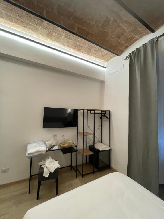 Postel nebo postele na pokoji v ubytování Hotel Felice