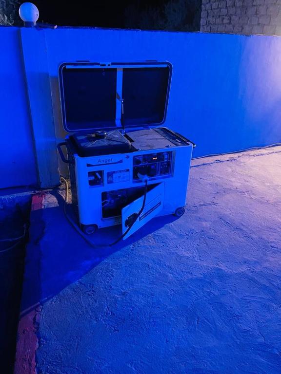a gaming system with a monitor on top of it at Royal Resort Skardu in Skardu