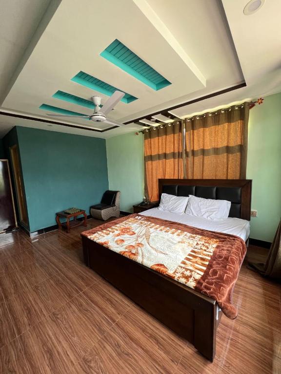 a bedroom with a large bed in a room at Royal Resort Skardu in Skardu