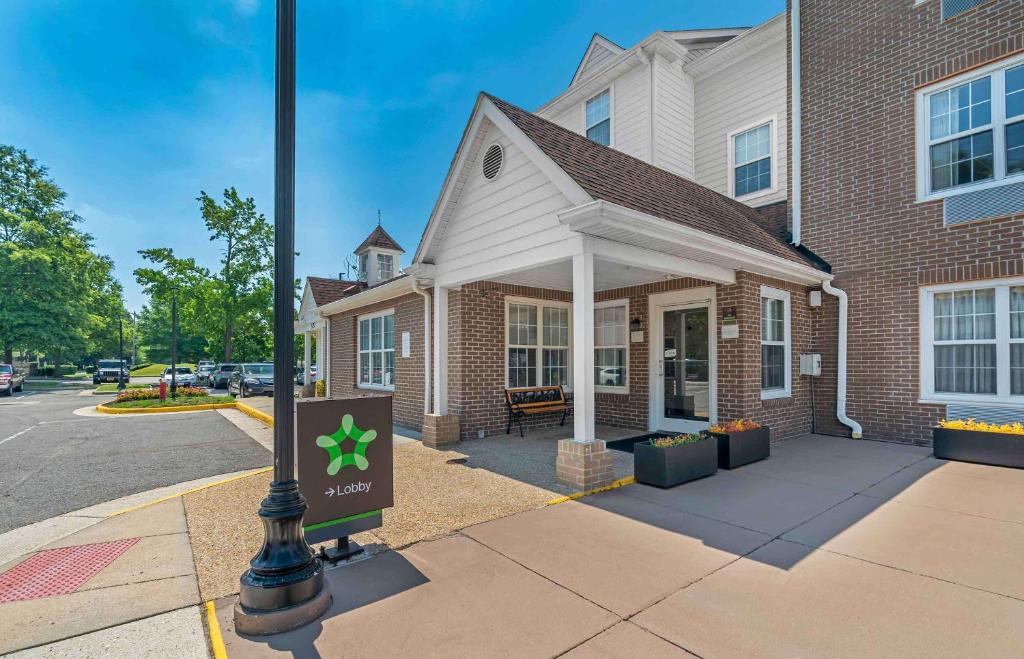 a building with a sign in front of it at Extended Stay America Suites - Norfolk - Virginia Beach in Virginia Beach