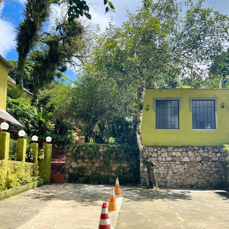 a group of traffic cones in front of a building at Cedros Pousada in Guaramiranga