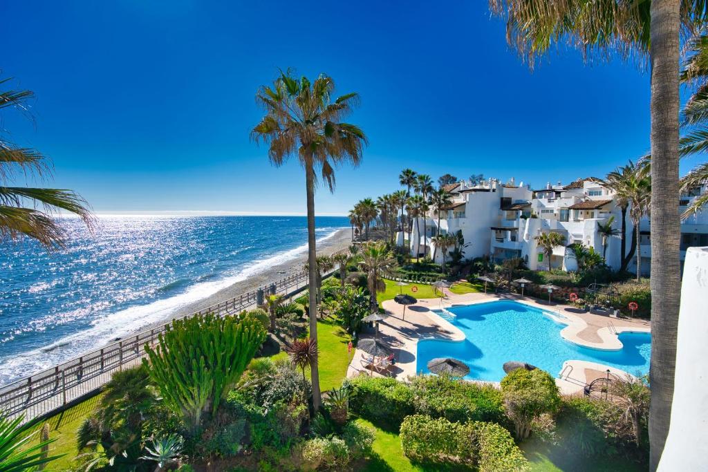 an aerial view of a resort with a swimming pool and the beach at Ventura Del Mar in Marbella