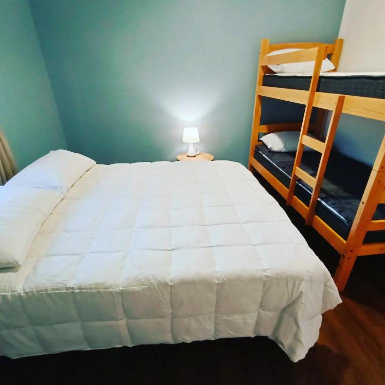 Postel nebo postele na pokoji v ubytování Cabañas Nonito