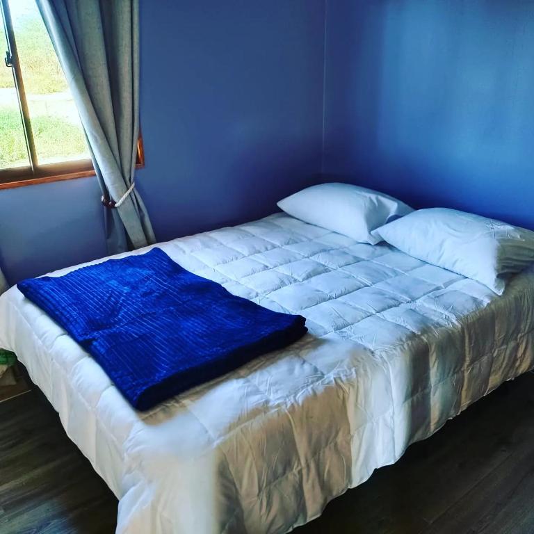 Postel nebo postele na pokoji v ubytování Cabañas Nonito