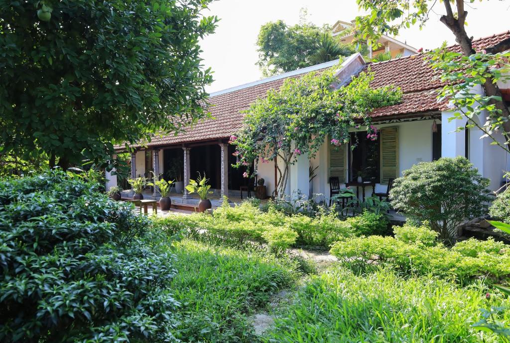 a garden in front of a house at Thom's House in Ninh Binh