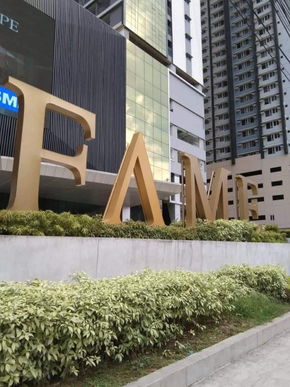a sign for the ak sign in front of a building at The ICONIC: Comfortable living by Awsom Phil in Manila