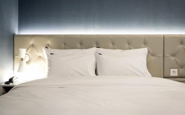 Postel nebo postele na pokoji v ubytování Hotel Yaja Gwangalli
