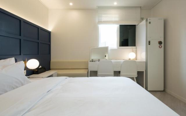 Postel nebo postele na pokoji v ubytování Hotel Yaja Gwangalli