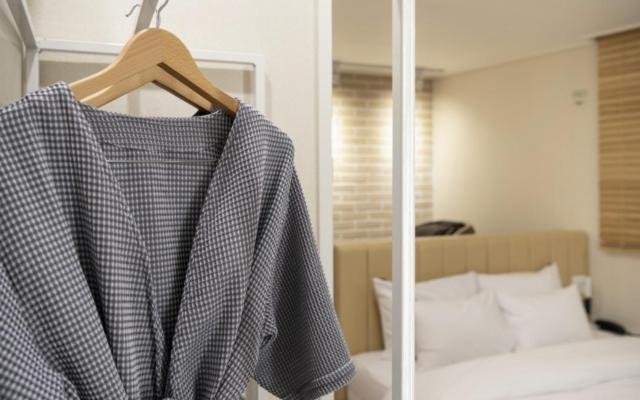 Postel nebo postele na pokoji v ubytování Hotel Yaja Gwangalli