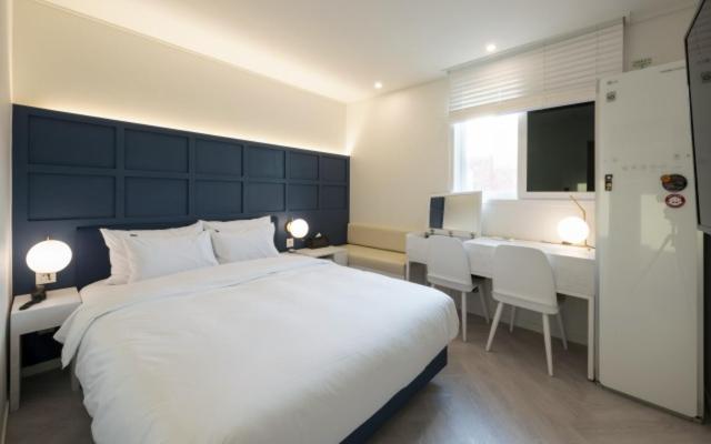 Postel nebo postele na pokoji v ubytování Hotel Yaja Gwangalli