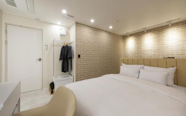 Postel nebo postele na pokoji v ubytování Hotel Yaja Gwangalli