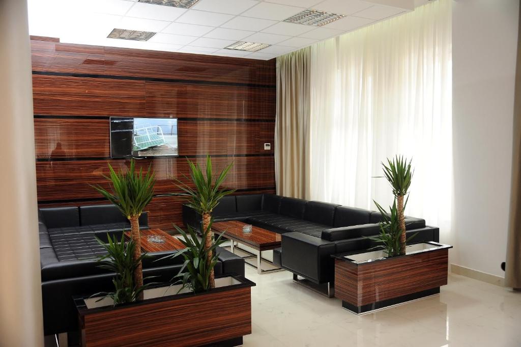 TV a/nebo společenská místnost v ubytování Garni Uni Elita Lux Hotel