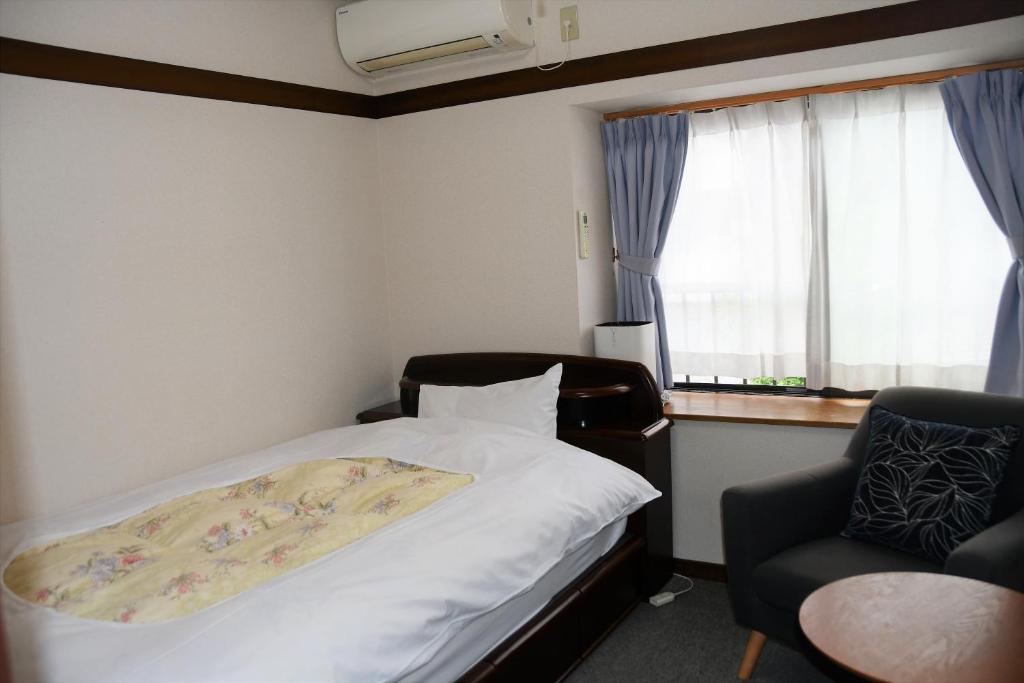 Postel nebo postele na pokoji v ubytování Ryokan Seifuso