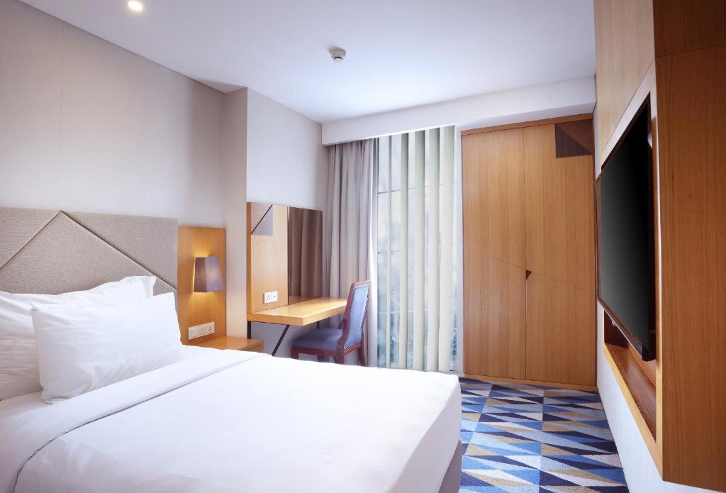 Swiss-Belhotel Pondok Indah - 两居室家庭套房，配有皇后和单人床