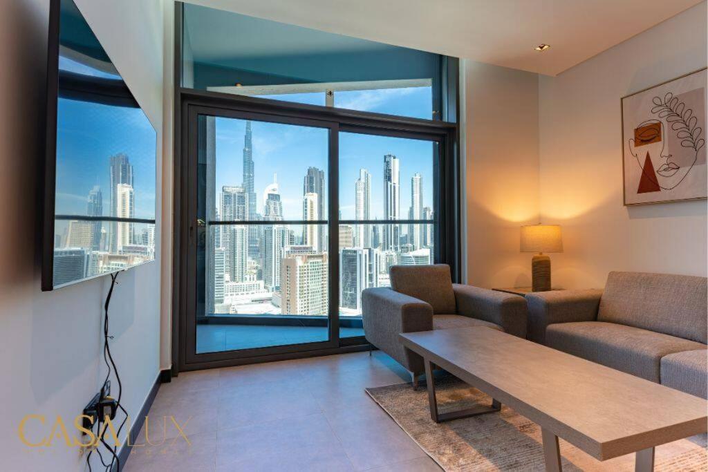 Posezení v ubytování Stunning 1 Bed With Burj Khalifa & Canal View