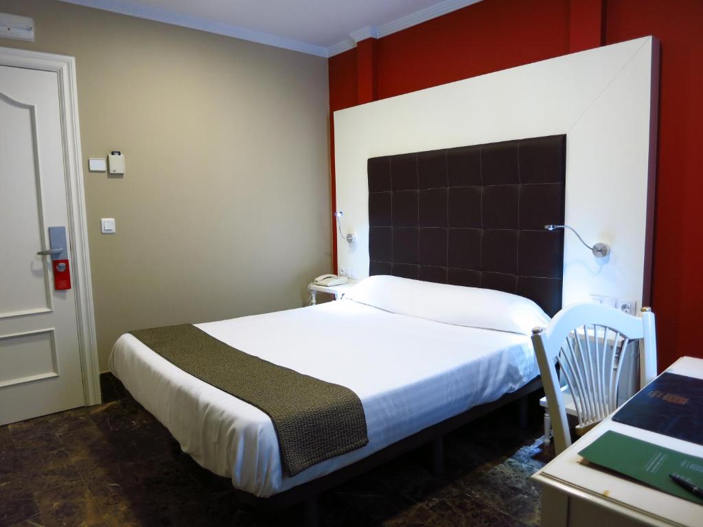 Postel nebo postele na pokoji v ubytování Hotel Boutique Catedral