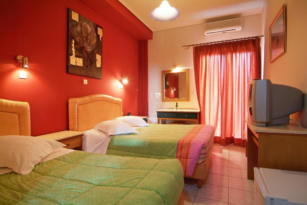 Postel nebo postele na pokoji v ubytování Hotel Varonos