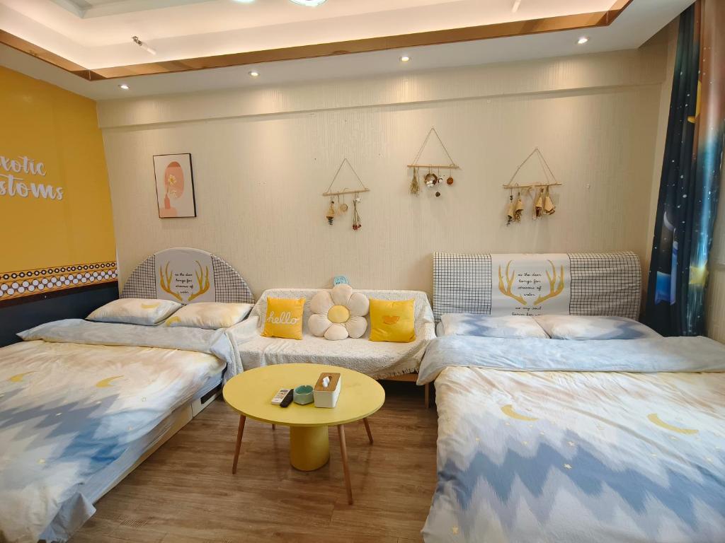 Postel nebo postele na pokoji v ubytování Yu Jing Xuan Boutique Apartment