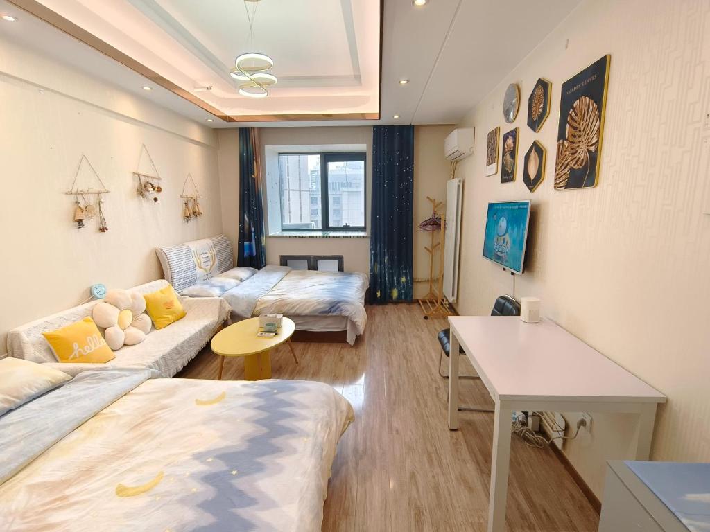 Postel nebo postele na pokoji v ubytování Yu Jing Xuan Boutique Apartment