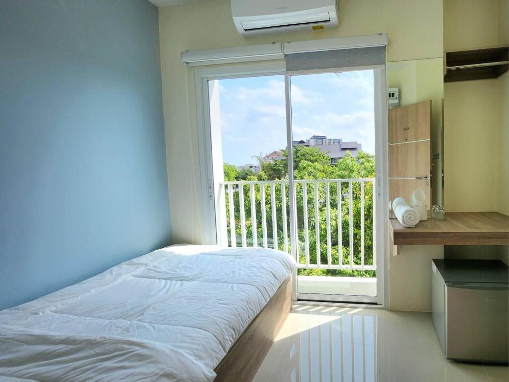 Postel nebo postele na pokoji v ubytování 98 Tower Chiang Mai