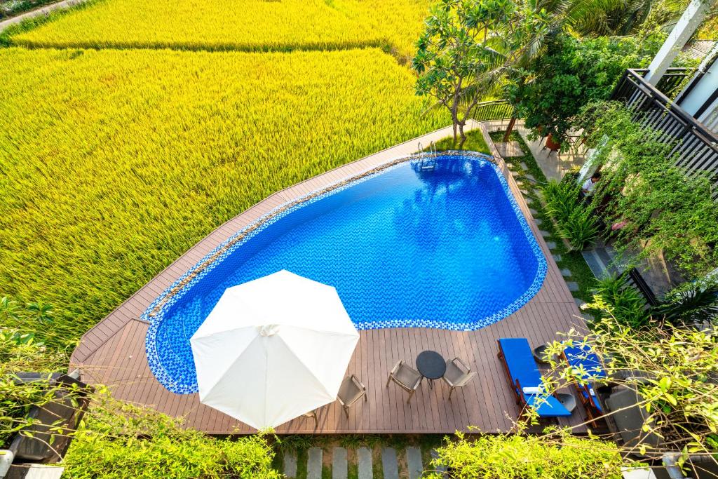 Bazén v ubytování Sunkised Paddy Hoi An Villa nebo v jeho okolí