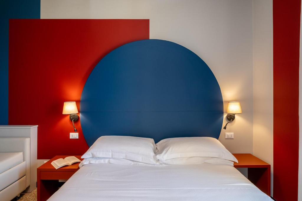 Postel nebo postele na pokoji v ubytování Hotel Doria