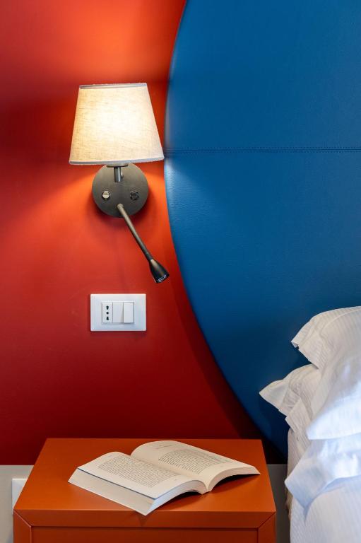 Postel nebo postele na pokoji v ubytování Hotel Doria