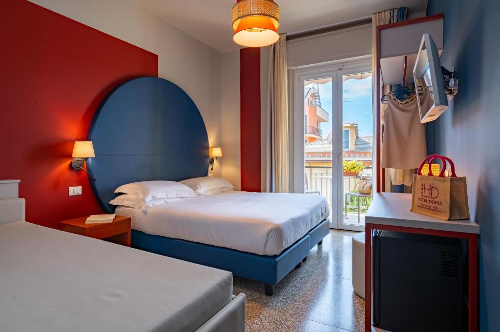 Postel nebo postele na pokoji v ubytování Hotel Doria
