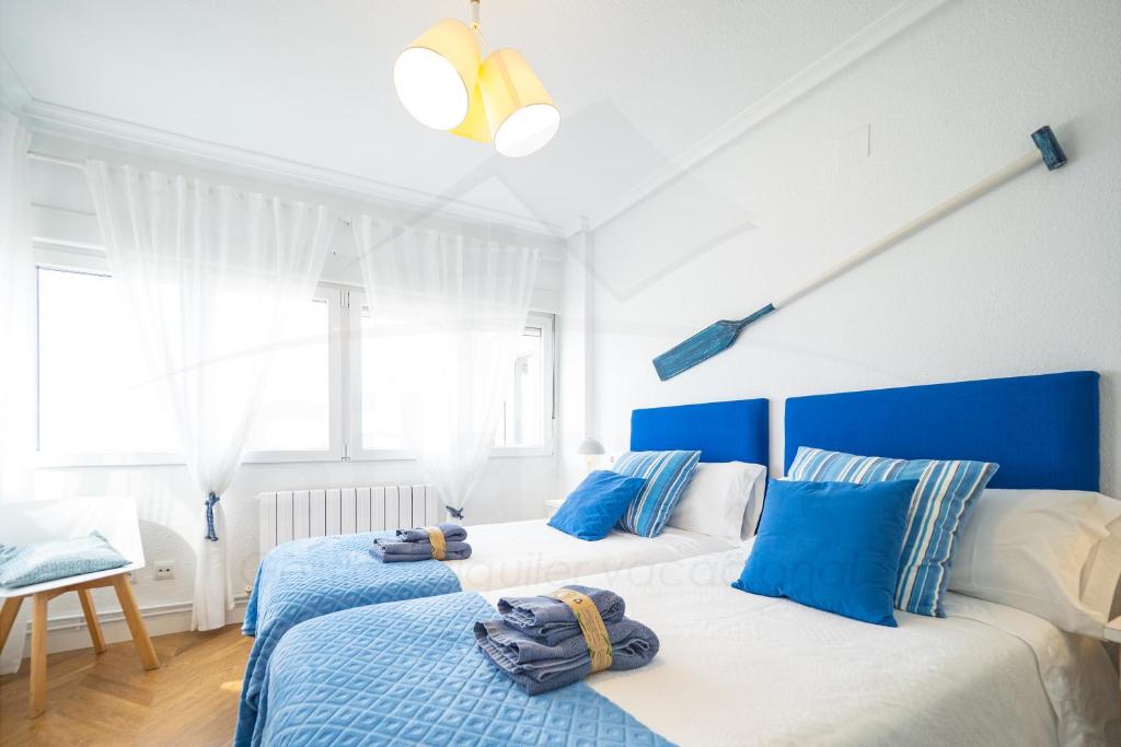 Кровать или кровати в номере Playa Apartamento Frente al mar