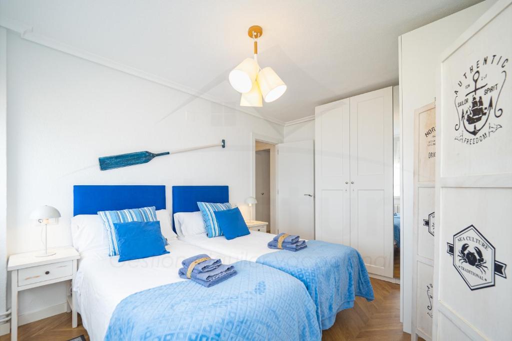 Кровать или кровати в номере Playa Apartamento Frente al mar