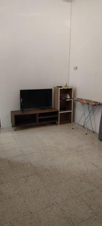 TV a/nebo společenská místnost v ubytování NTC Homestay at Parit Buntar