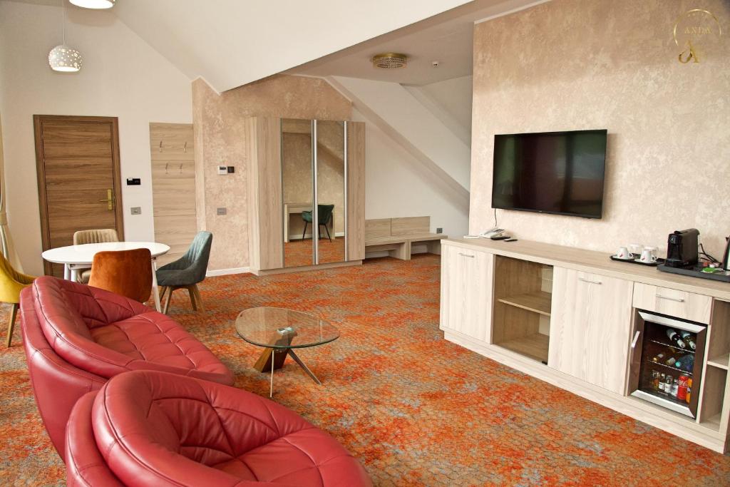 TV a/nebo společenská místnost v ubytování Hotel Anda
