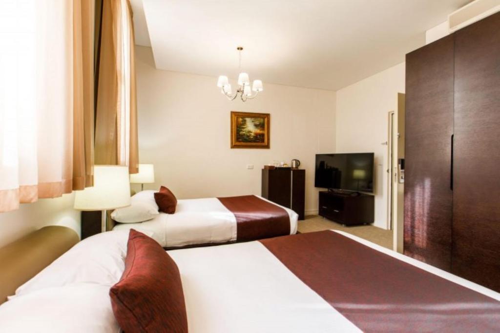 Postel nebo postele na pokoji v ubytování Adabco Boutique Hotel Adelaide