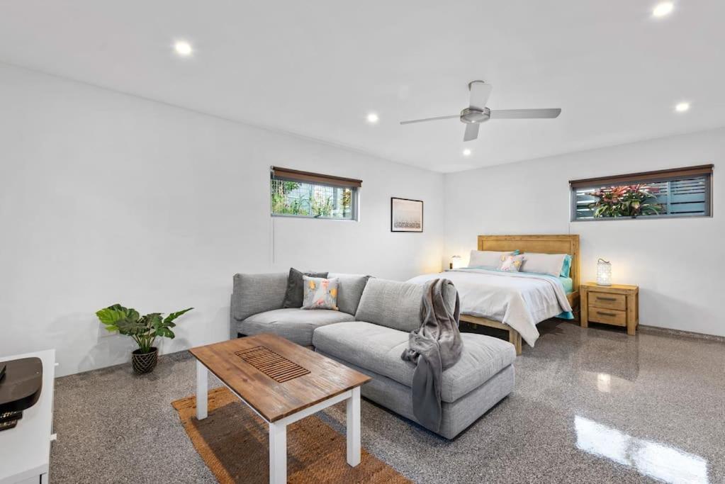 a living room with a couch and a bed at Scarborough Beach Break Holidays - Unit 5 in Scarborough