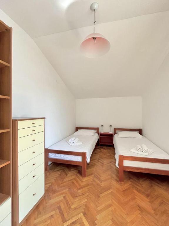 Posteľ alebo postele v izbe v ubytovaní Lemon Tree Apartments