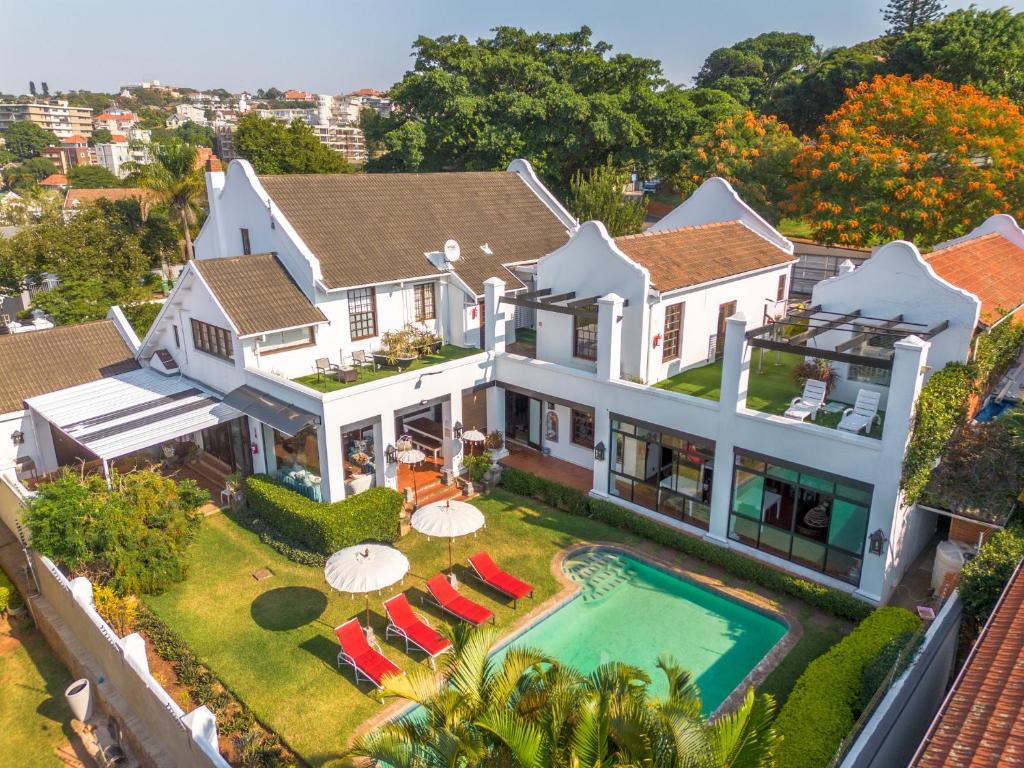an aerial view of a house with a swimming pool at Holland House B&B in Durban