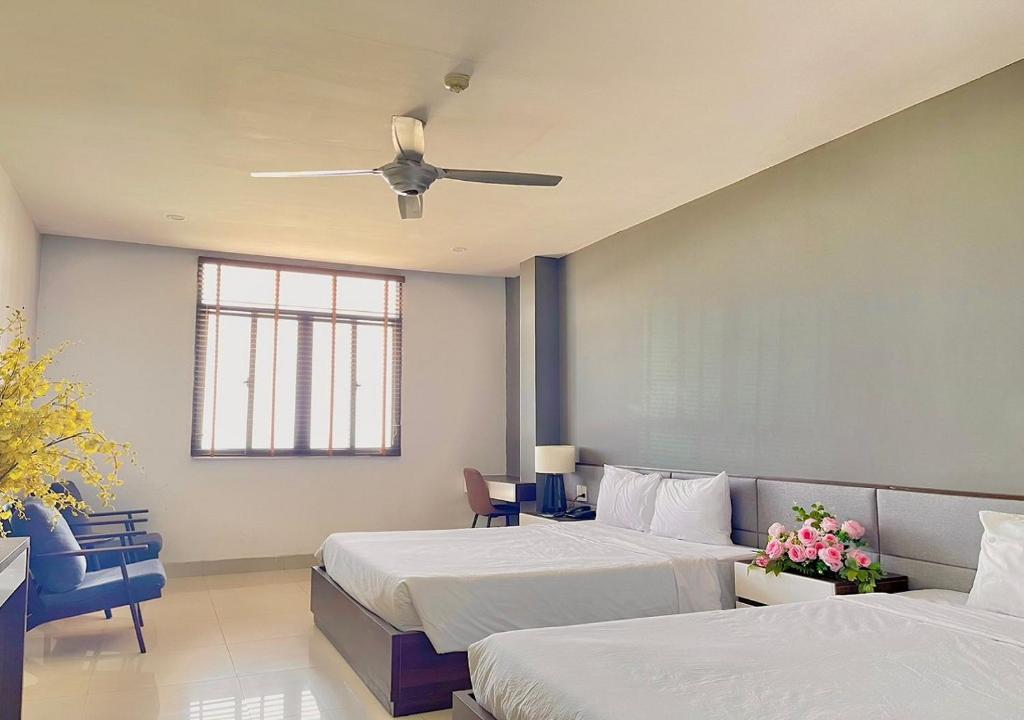 Voodi või voodid majutusasutuse My Khe 2 Da Nang Seafront Hotel toas
