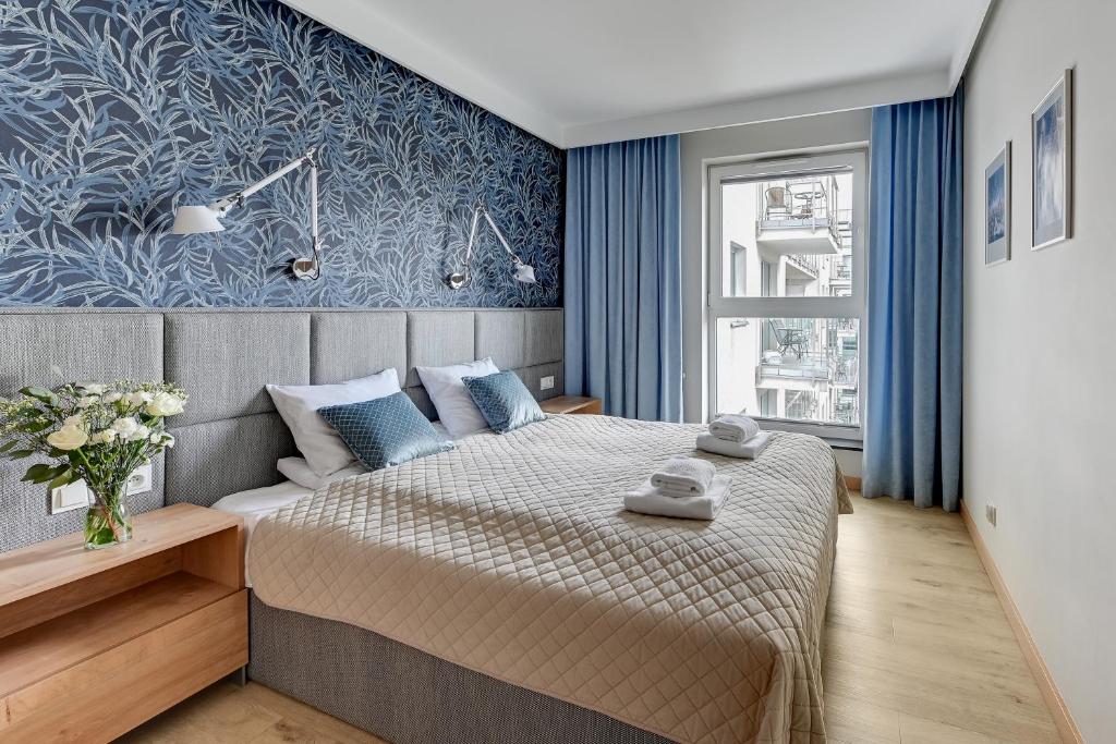 Postel nebo postele na pokoji v ubytování Blue Mandarin Marina