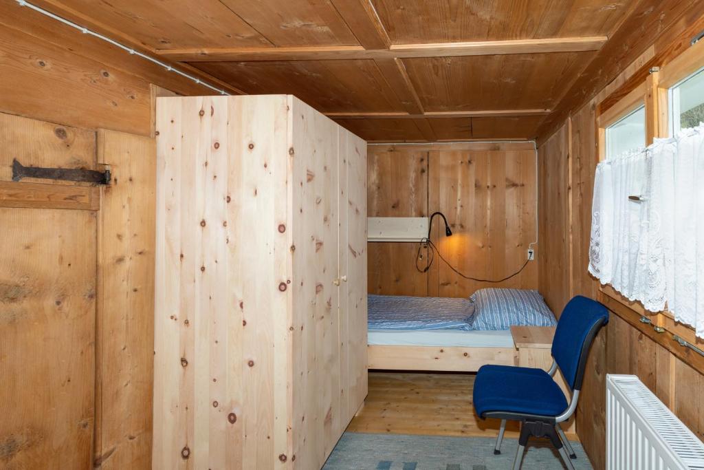Postel nebo postele na pokoji v ubytování Haus Holzwurm