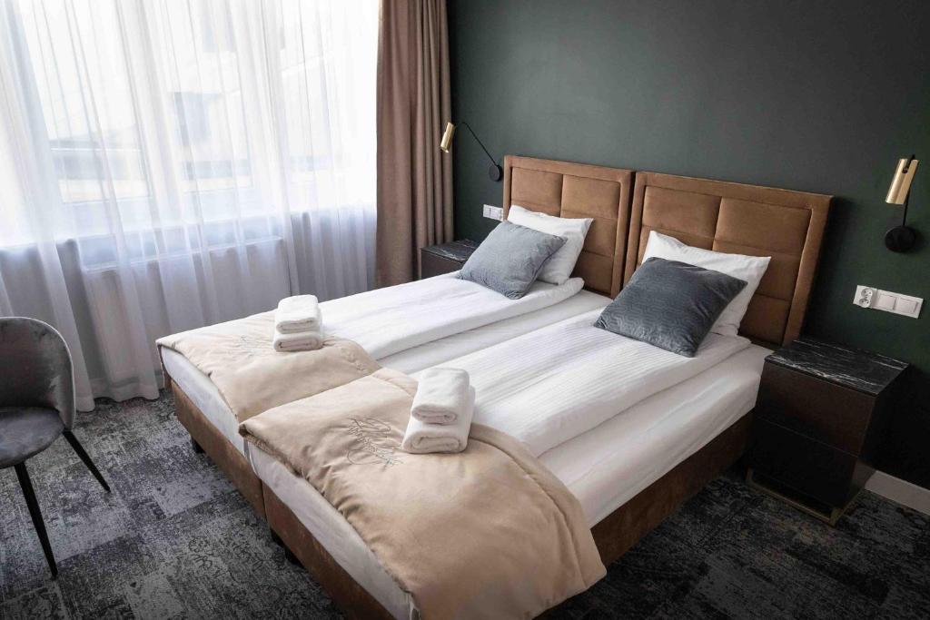 Postel nebo postele na pokoji v ubytování 4Wings Apartments