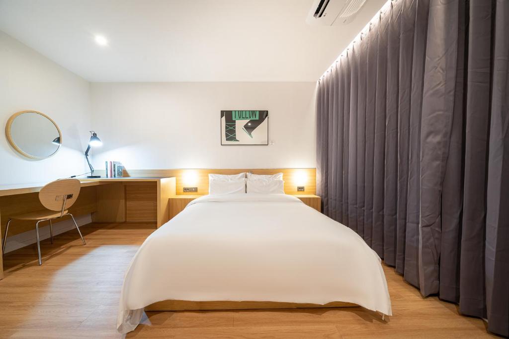 Postel nebo postele na pokoji v ubytování Aank Hotel Daejeon Yongjeon 2nd