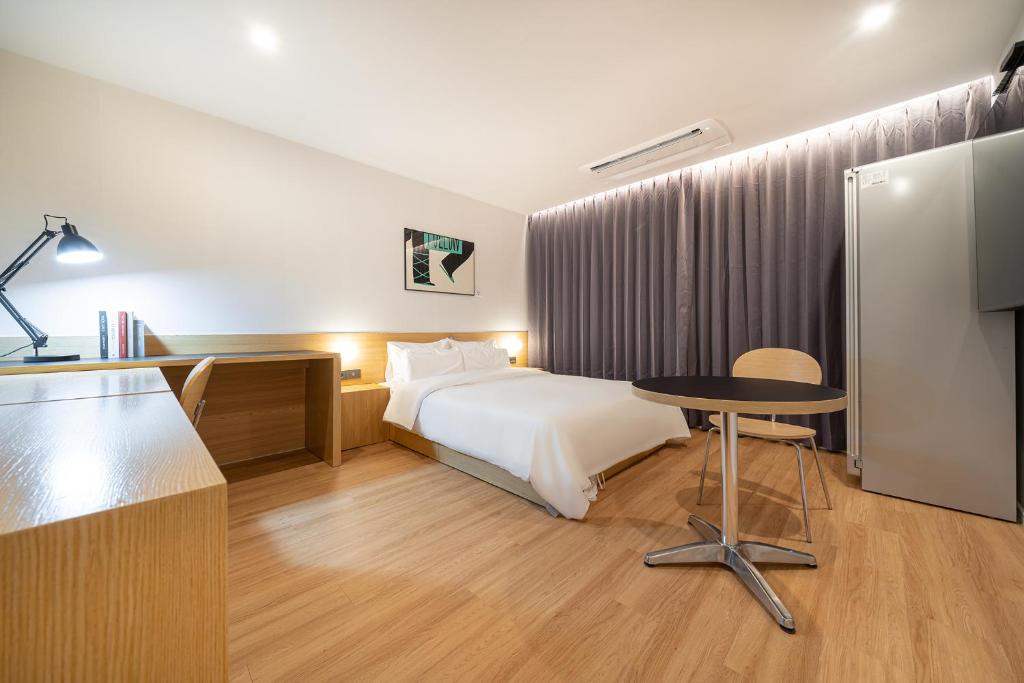 Postel nebo postele na pokoji v ubytování Aank Hotel Daejeon Yongjeon 2nd