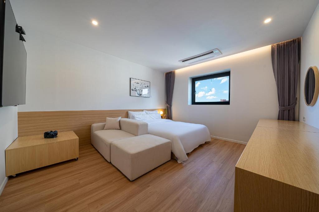 Postel nebo postele na pokoji v ubytování Aank Hotel Daejeon Yongjeon 2nd