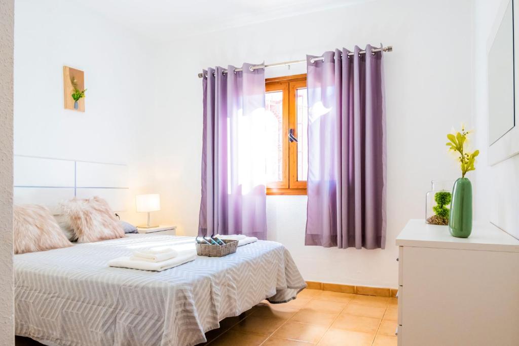 Posteľ alebo postele v izbe v ubytovaní Live Caletillas Taunus