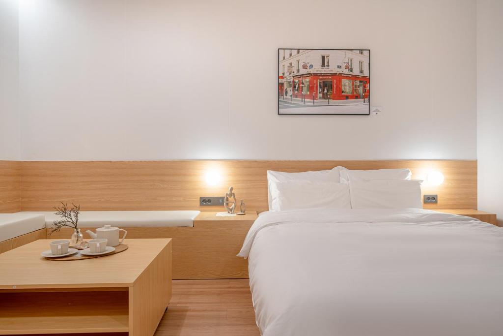 Postel nebo postele na pokoji v ubytování Aank Hotel Daejeon Yongjeon 2nd