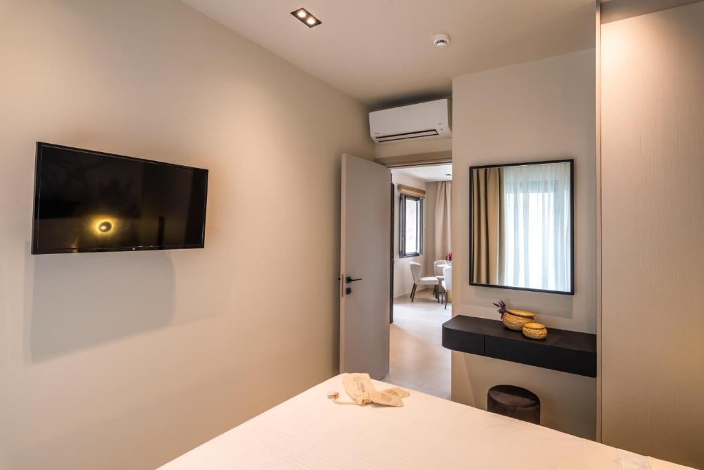 Postel nebo postele na pokoji v ubytování Hara Suites