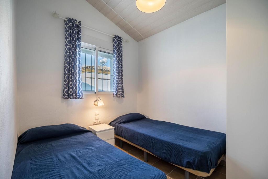 Postel nebo postele na pokoji v ubytování La Casita Azul - Mayores de 25