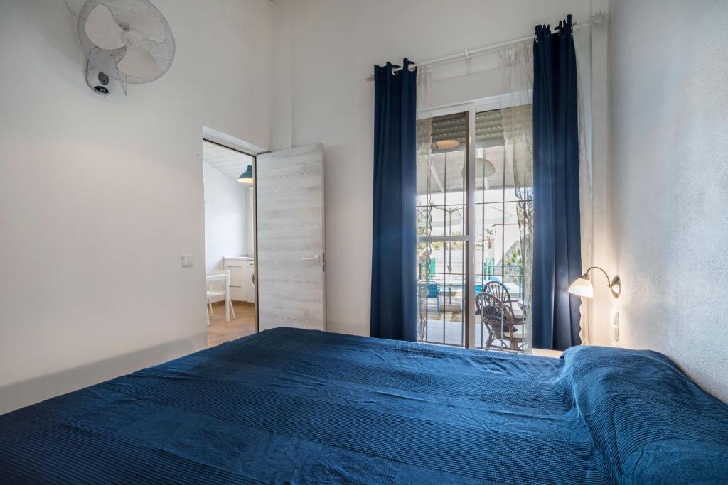 Postel nebo postele na pokoji v ubytování La Casita Azul - Mayores de 25