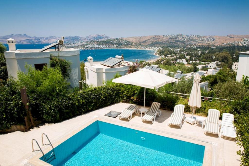 a villa with a swimming pool and a view at Villa Manzara by Important Group Travel in Bitez