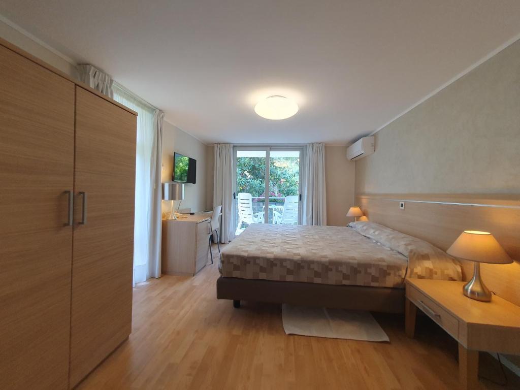 Postel nebo postele na pokoji v ubytování Hotel Eurovil Garni